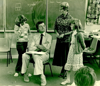 Mary Egan(standing)in a classroom. Barry Fitzgerald, Head of the School of Education at Ballarat College Advanced Education, sits on a chair.(Cat.No.4231)